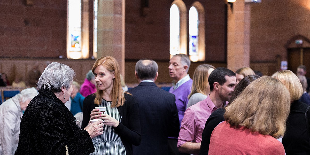 Members of the congregation chatting to eachother